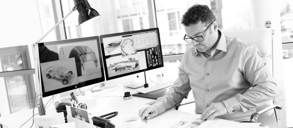 Adrian Cartwright working at his desk